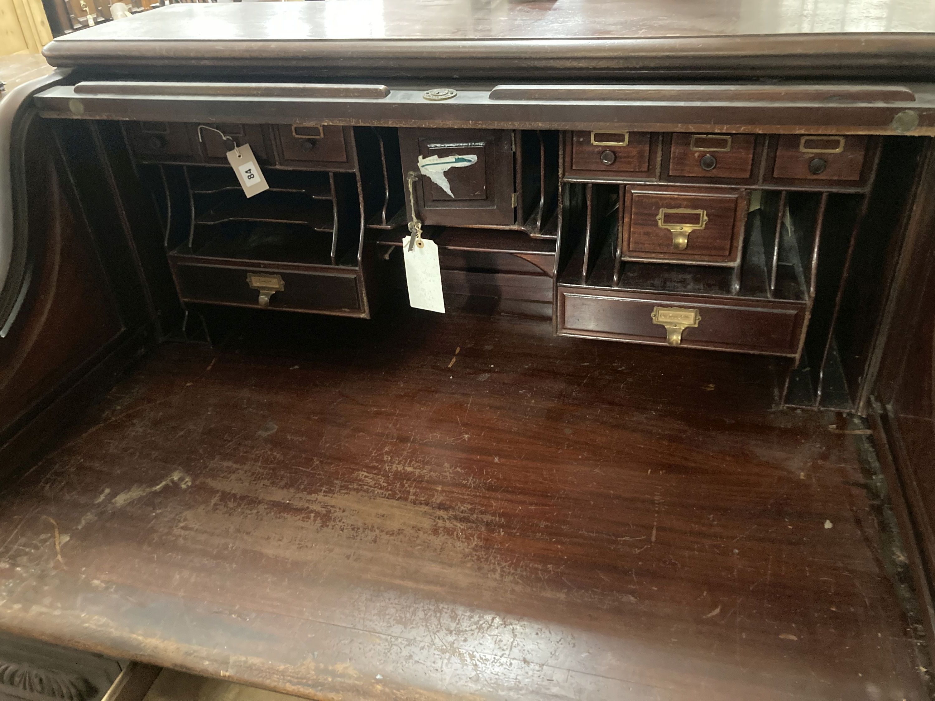 An Edwardian mahogany S roll top desk, width 128cm, depth 92cm, height 132cm